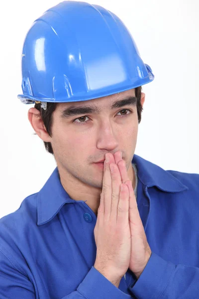 Workman håller händerna ihop — Stockfoto