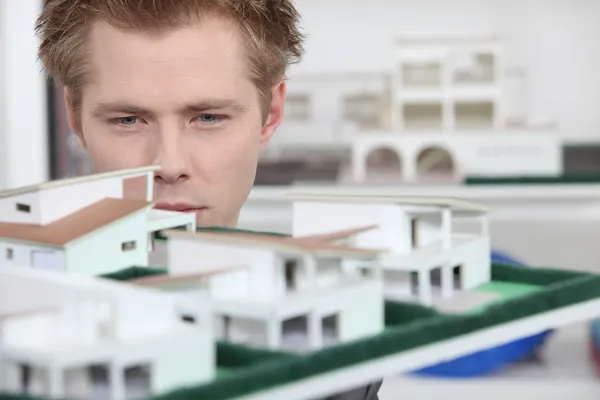 stock image Property developer inspecting model