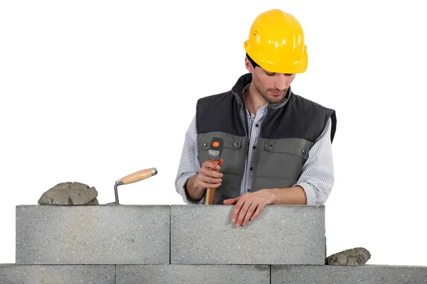 Labourer stood, by equipment pointing — Stock Photo, Image