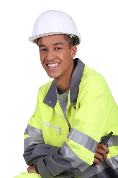 stock image Young worker in a fluorescent jacket