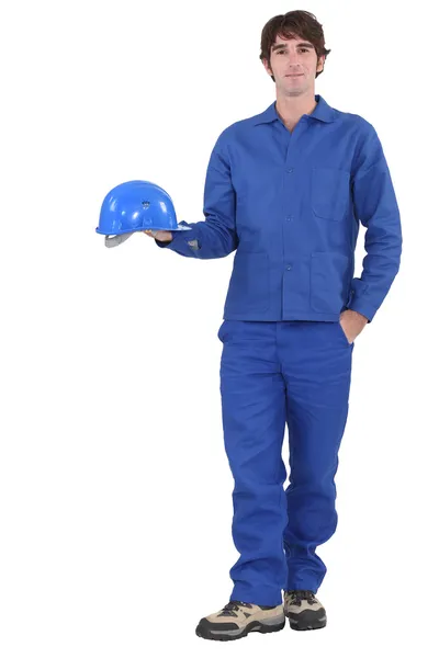 Hepsi mavi giyinmiş bir inşaat işçisi. — Stok fotoğraf