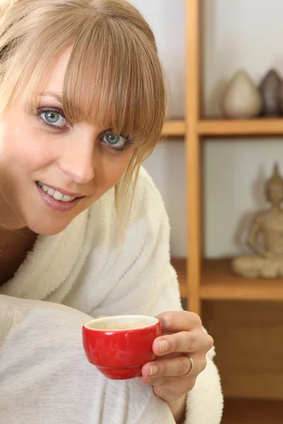 Woman with a hot drink — Stock Photo, Image