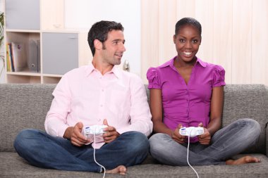 Couple playing computer games clipart