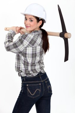 Woman carrying pick-axe clipart