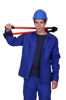 Craftsman holding a n enormous pair of pliers clipart