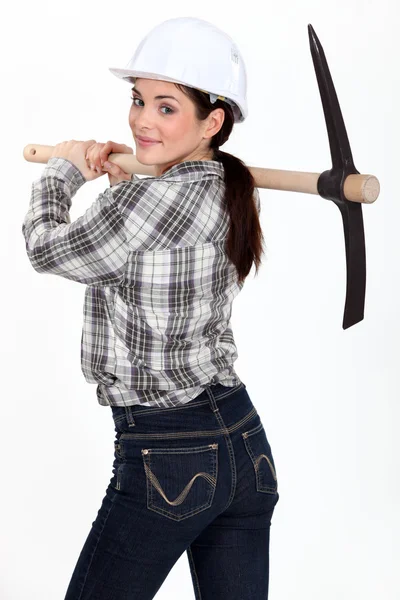 stock image Woman carrying pick-axe