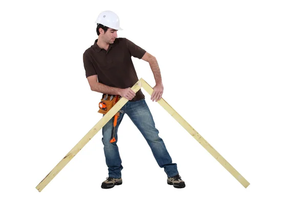 Woodworker erecting frame — Stock Photo, Image