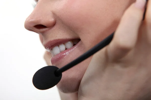 Closeup of a woman speaking into a microphone — Stock Photo, Image