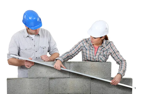Two masons working on a wall. — Stock Photo, Image