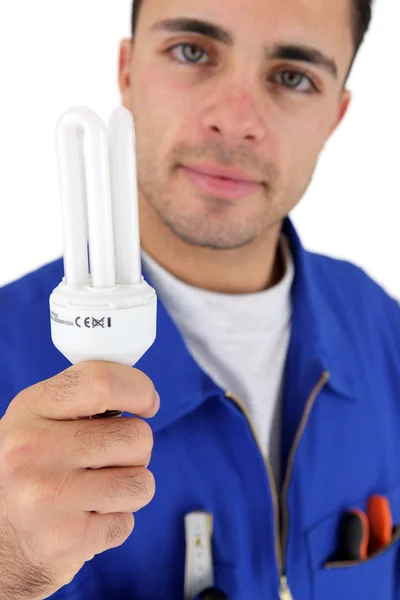 Electrician holding bulb — Stock Photo, Image