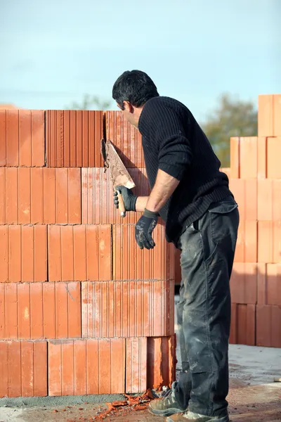 stock image Builder laying blocks