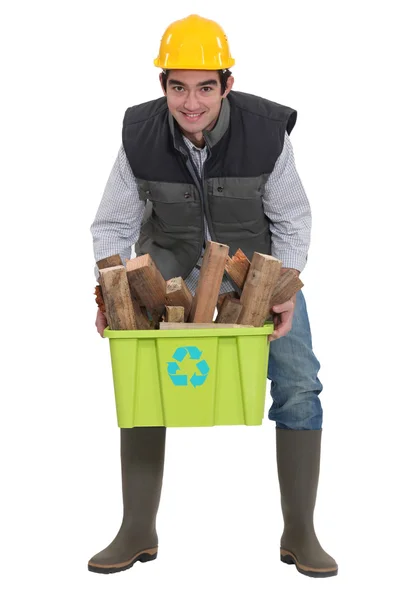 A construction worker recycling. — Stock Photo, Image
