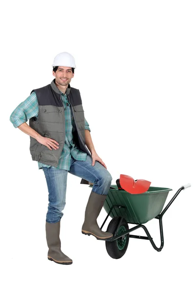 Builder with a wheelbarrow — Stock Photo, Image