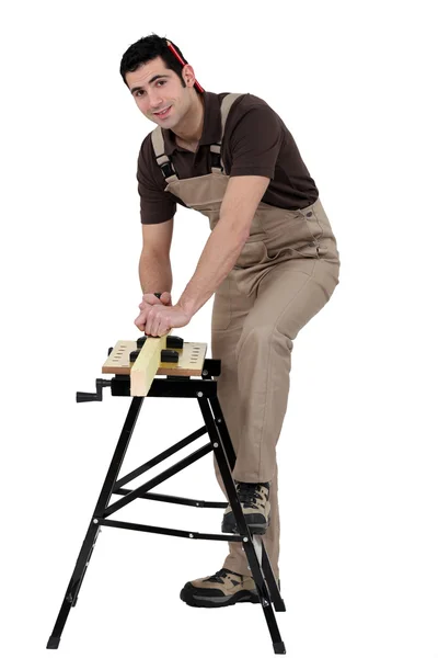 Carpenter at work with workbench — Stock Photo, Image