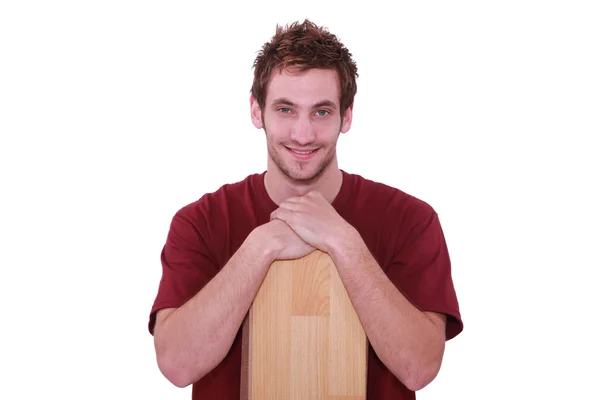 Young man with wooden floor boards — Stock Photo, Image