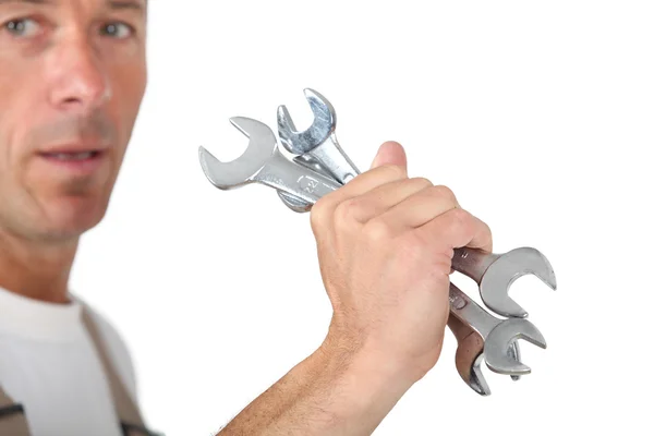 Man holding spanners — Stock Photo, Image