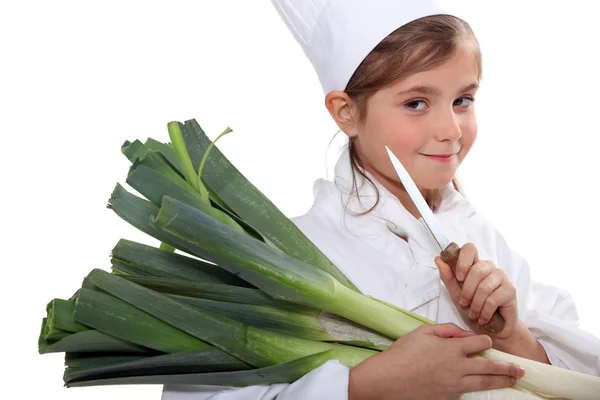 Porträt eines kleinen Mädchens in Kochkleidung — Stockfoto