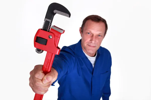 Plumber holding wrench — Stock Photo, Image