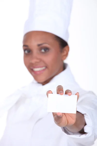 Chef-kok houden een businesscard — Stockfoto