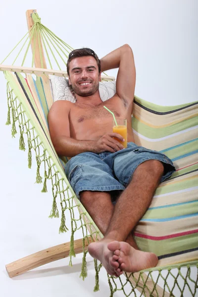 Man lying in a hammock — Stock Photo, Image