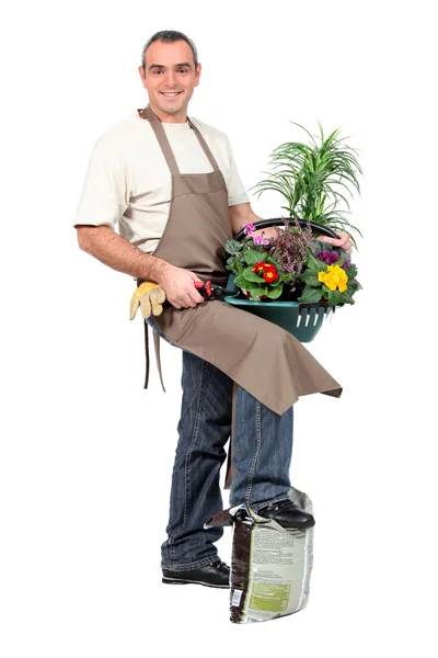 Leende trädgårdsmästare på vit bakgrund — Stockfoto