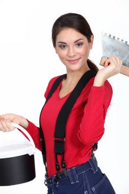 Female plasterer holding tool clipart
