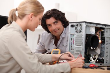 Woman fixing a computer clipart