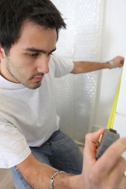 Man taking measurements clipart