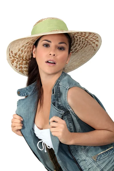 Flirtatious brunette wearing hat — Stock Photo, Image