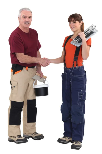Tradespeople forming a partnership — Stock Photo, Image