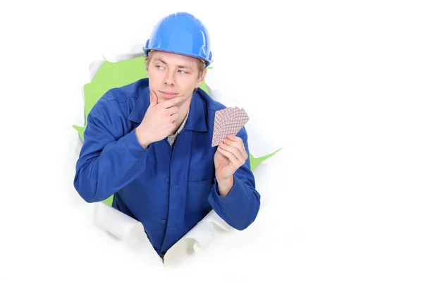 Worker with playing cards — Stock Photo, Image