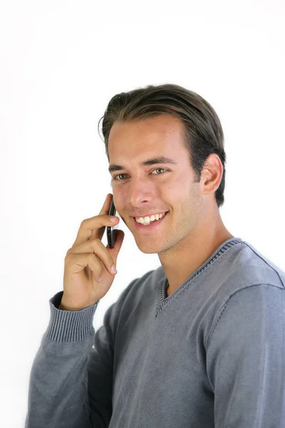 Uśmiechnięty mężczyzna mówić na jego telefon komórkowy — Zdjęcie stockowe
