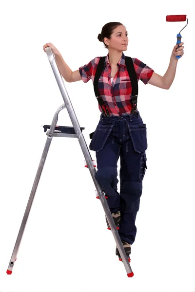 Woman with ladder painting — Stock Photo, Image