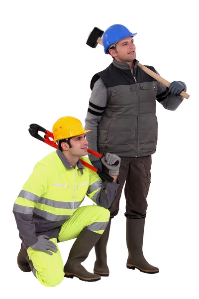 A team of labourers staring off into the distance — Stock Photo, Image