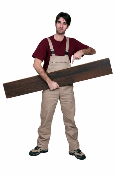 Man with wooden flooring — Stock Photo, Image
