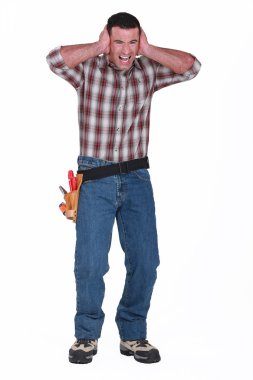 Builder with his hands over his ears clipart