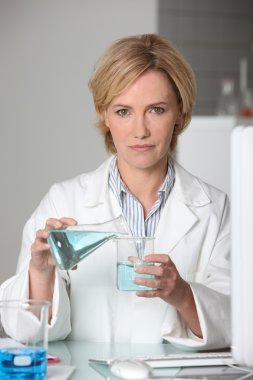 Scientist working in a lab clipart