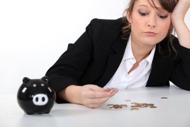 Woman counting her pennies clipart