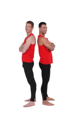 Gymnasts standing back to back clipart