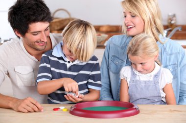 Parents playing with children clipart