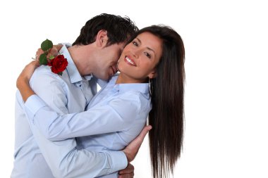 Woman offered rose by husband clipart