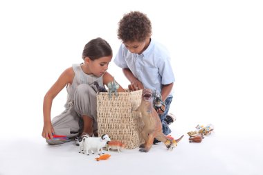 Young children playing with toys clipart