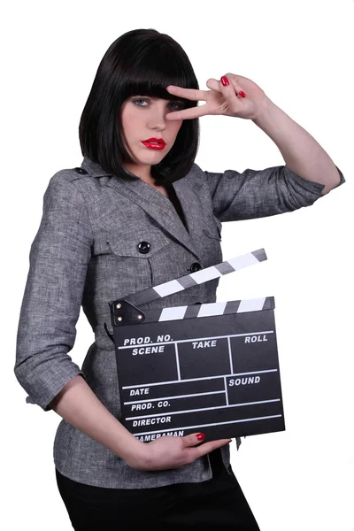 Woman with movie slate — Stock Photo, Image