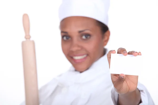 Female chef holding business card — Stock Photo, Image