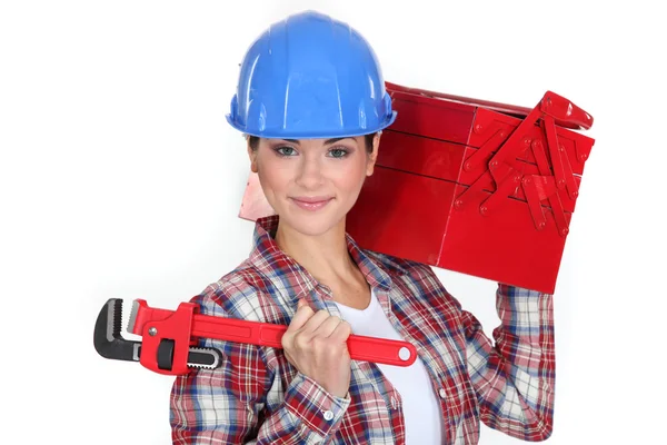 Woman carrying tool box on shoulder — Stock Photo, Image