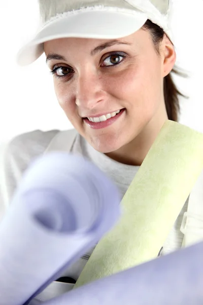 Female decorator holding selection of wall paper — Stock Photo, Image