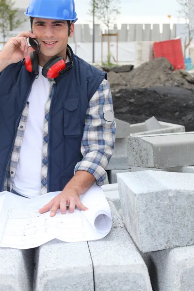 Operator on site with map — Stock Photo, Image