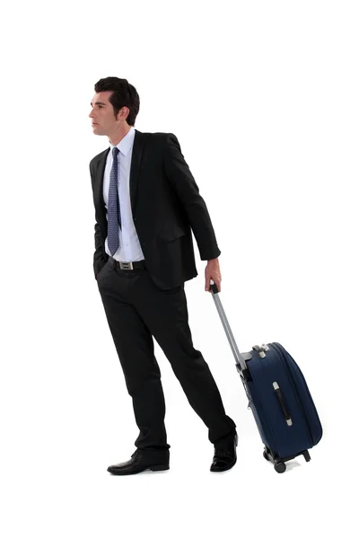 Бизнесмен с чемоданом — стоковое фото
