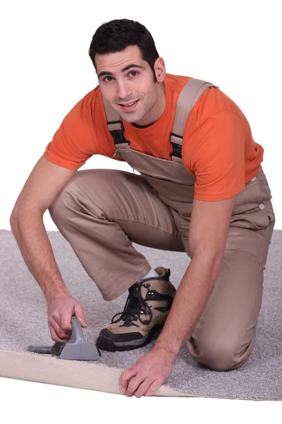 Man placing carpet — Stock Photo, Image