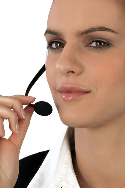Close-up of a woman using a telephone headset — Stok fotoğraf